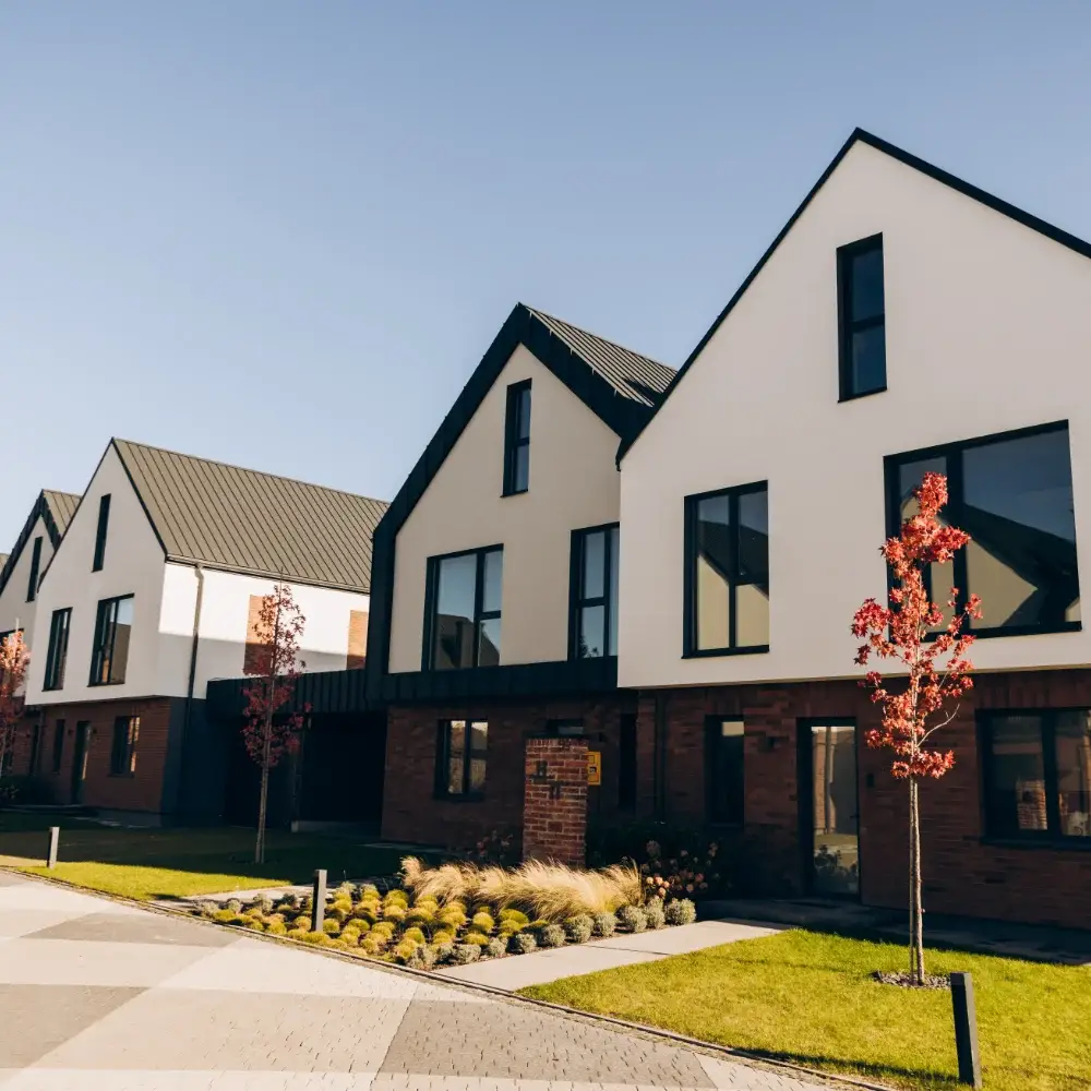 Modern new build townhouses with landscaped street and front gardens