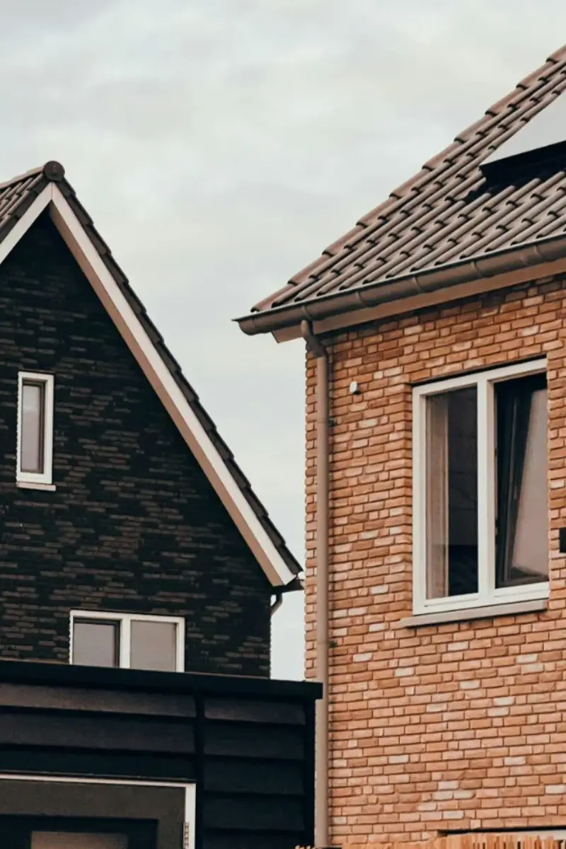Modern brick and slate residential homes viewed from below